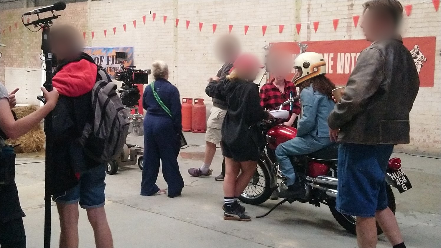 Triumph motorcycle on a film set with production crew