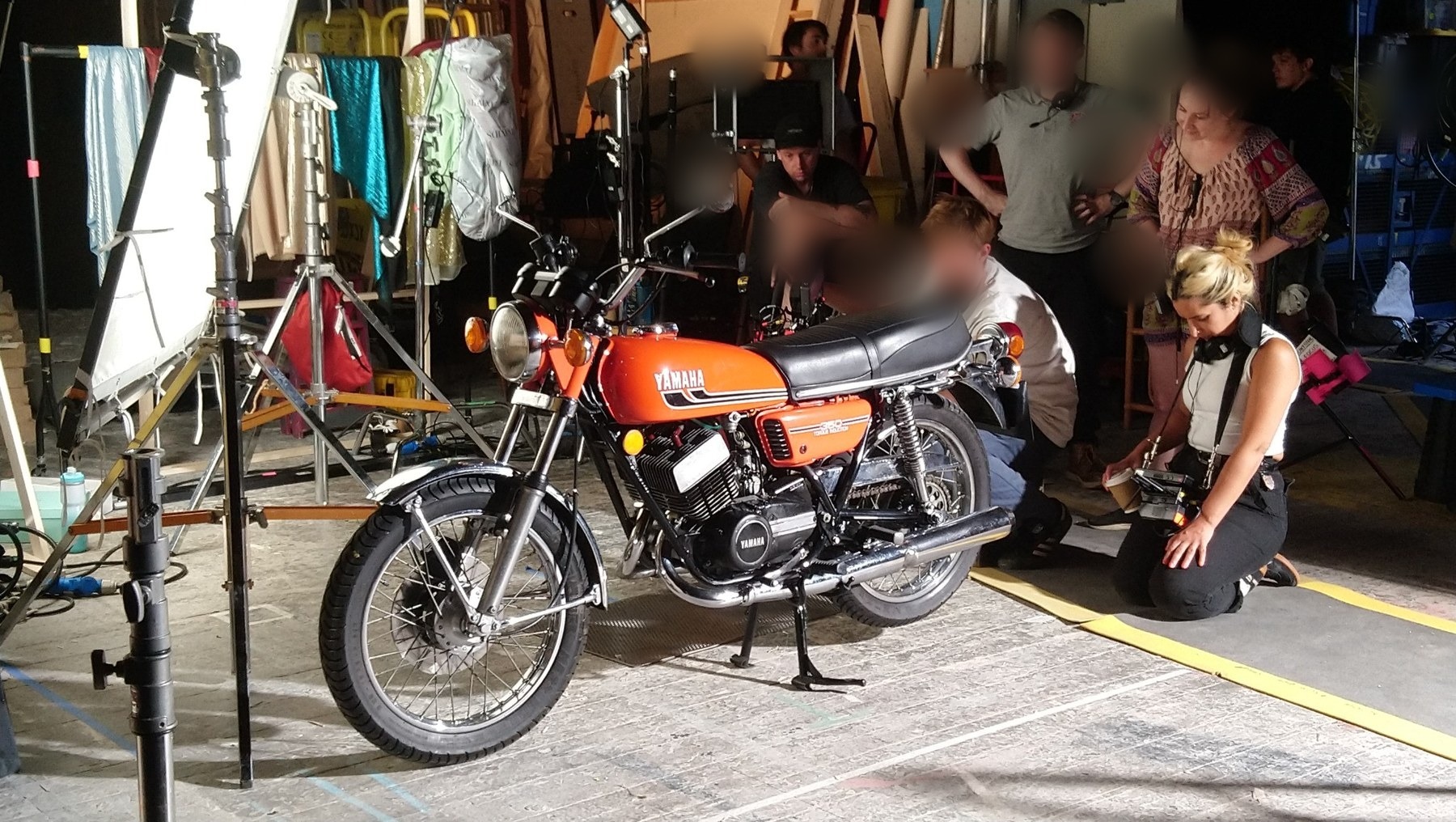Yamaha motorcycle on a film set with production crew